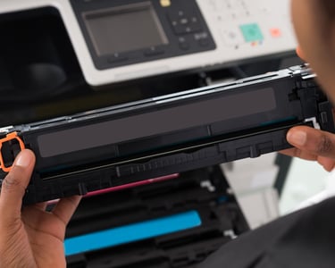 a person holding a printer and a printer