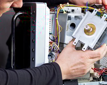 a man is fixing a computer monitor in a computer
