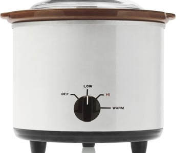 a crock pot with a lid on a crock pot