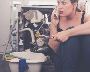 a woman in a black top hat and a white shirt is talking on the phone
