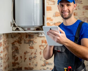a man in a blue shirt and a tablet computer