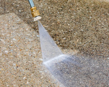 Pressure washing restoring a patio surface
