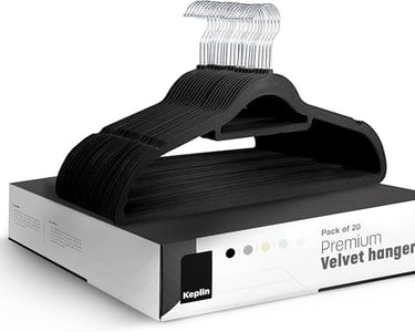 a black and white hangers with a hanger of clothes on it