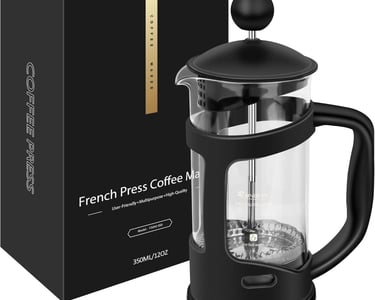 a french press coffee maker with a black box