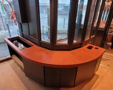 Comercial polished concrete round, red countertop