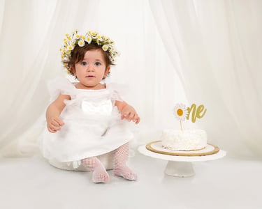 Smiling little one during a cake smash session.