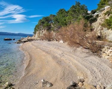 Rape beach western view with clear sea and pebble shore, Lokva Rogoznica
