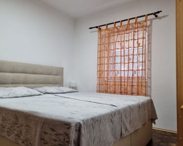 Quiet bedroom with double bed and orange curtains, Easy Living, Lokva Rogoznica