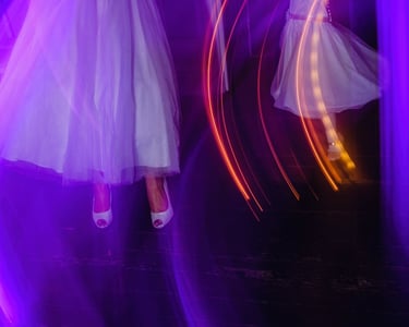 Blurry photo of dancing with purple lighting