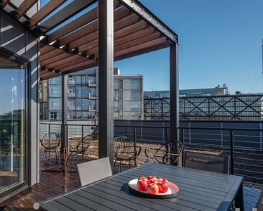 A photo of an exterior trellis over a rooftop deck