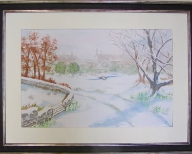 Watercolour of snow-covered road heading into town on a misty early morning. Snow-laden trees. 
