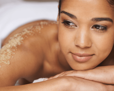 a woman enjoy body scrub at Kayuh Spa