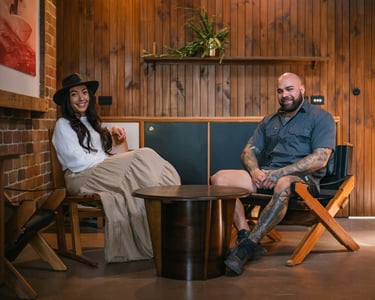 Rebecca and Michael sitting in chairs in a room