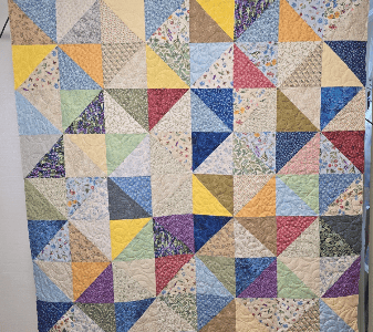 Memory quilt using women's dresses