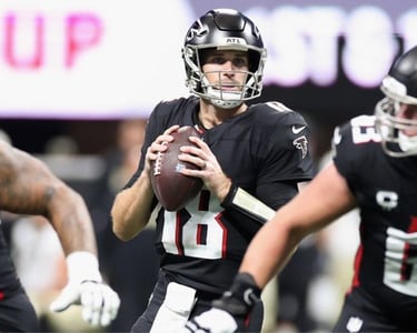 Kirk Cousins (18) playing QB for the Atlanta Falcons during the 2025 season.