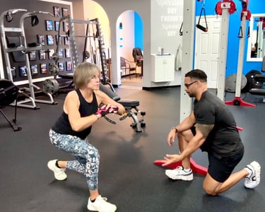 fitness coach helping woman how to lunge exercise