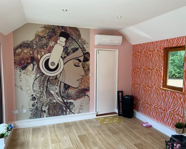 Feature wall wallpaper installation with bespoke mural and wood flooring in a Brighton home