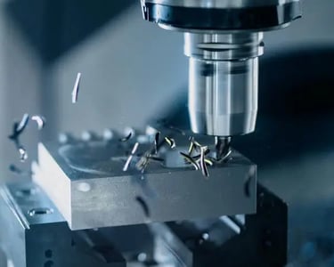 CNC machine cutting metal representing precision engineering and industrial manufacturing expertise