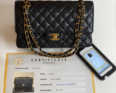 a black Chanel handbag with original documentation and certificate of authenticity