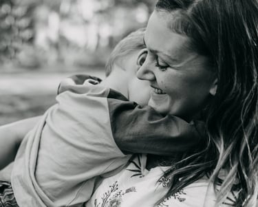 a woman holding a child in her arms