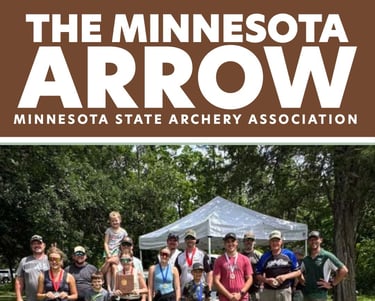 A group of archers posing for a photo wearing their medals they recieved.