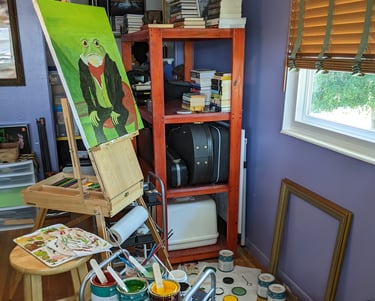 Kathy LaFollett's art studio showing a canvas art painting in progress.