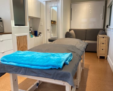 treatment table with a blue blanket