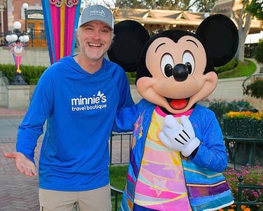 Chris Breedlove pictured with Mickey Mouse at Disneyland® Park.