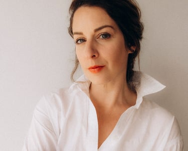 a woman in a white shirt and red lipstick