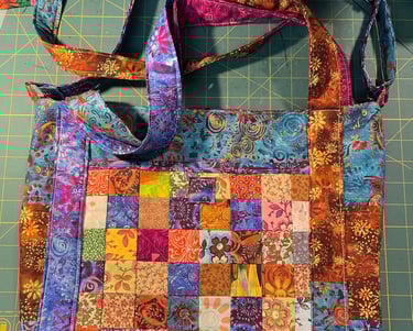 a purse bag with a patchwork design