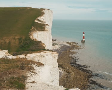 Beachy Head UK view of white cliff in england with light house