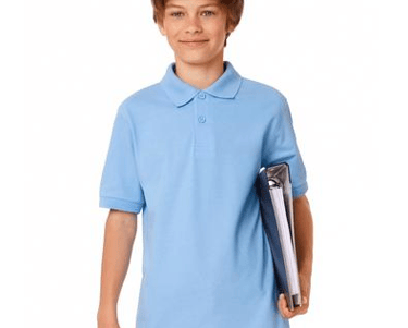 a boy in a blue shirt holding a tennis racket