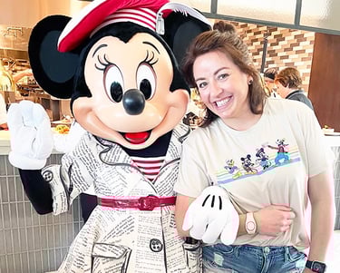 Dasee Johnson pictured with Minnie Mouse at Walt Disney World®.
