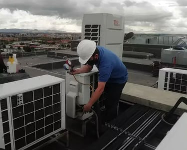 a man in a white helmet and a white helmet on a roof