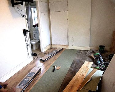 a wood installation process, with a lot of wood flooring