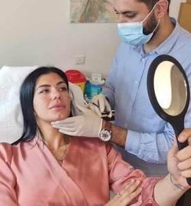 a woman in a mask mask and a man in a mask