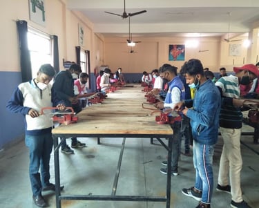 a group of people standing around a table with a table with a table top