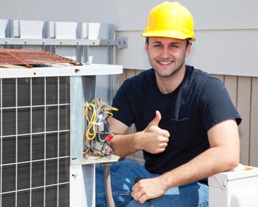 a man in a hard hat and a yellow helmet fixing a broken air conditioning unit