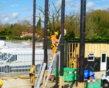 Our trainee on ladder against our training telephone pole