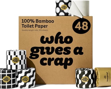 a box of toilet paper rolls with a black and white polka dot