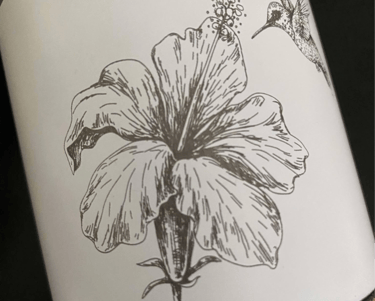 a bottle of wine with a hummingbird on it