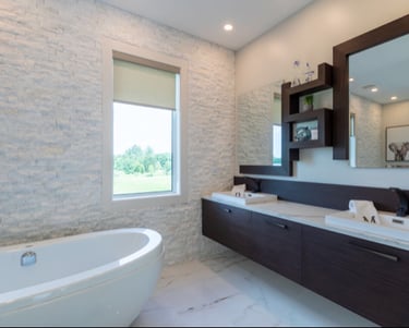 a bathroom with a tub tub and a large mirror