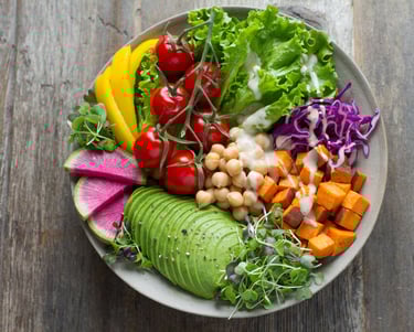 a bowl of vegetables with healthy nutrition required healthy hair