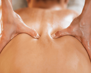 a woman having her back massaged
