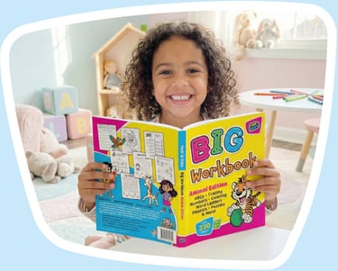 cute girl reading a copy of Fesh and Ocky's Big Workbook: Animal Edition