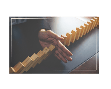 a person holding a domino board game