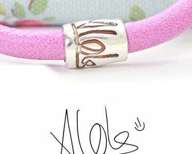 A Pandora compatible tube bead with your child's handwritten name on.