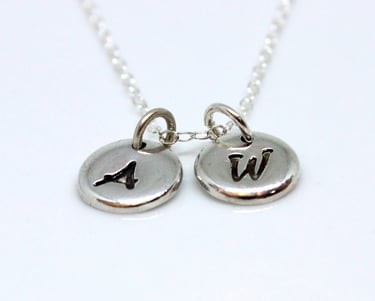 Silver jewellery personalised with initials, names, dates and messages 