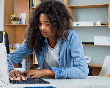 Student engaged in online math tutoring using a computer to learn and solve math problems