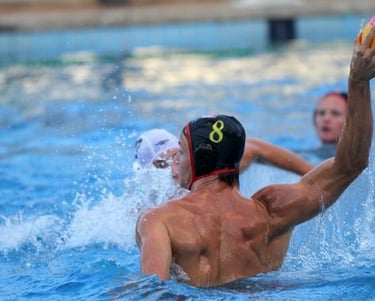 a man playing water polo in a pool